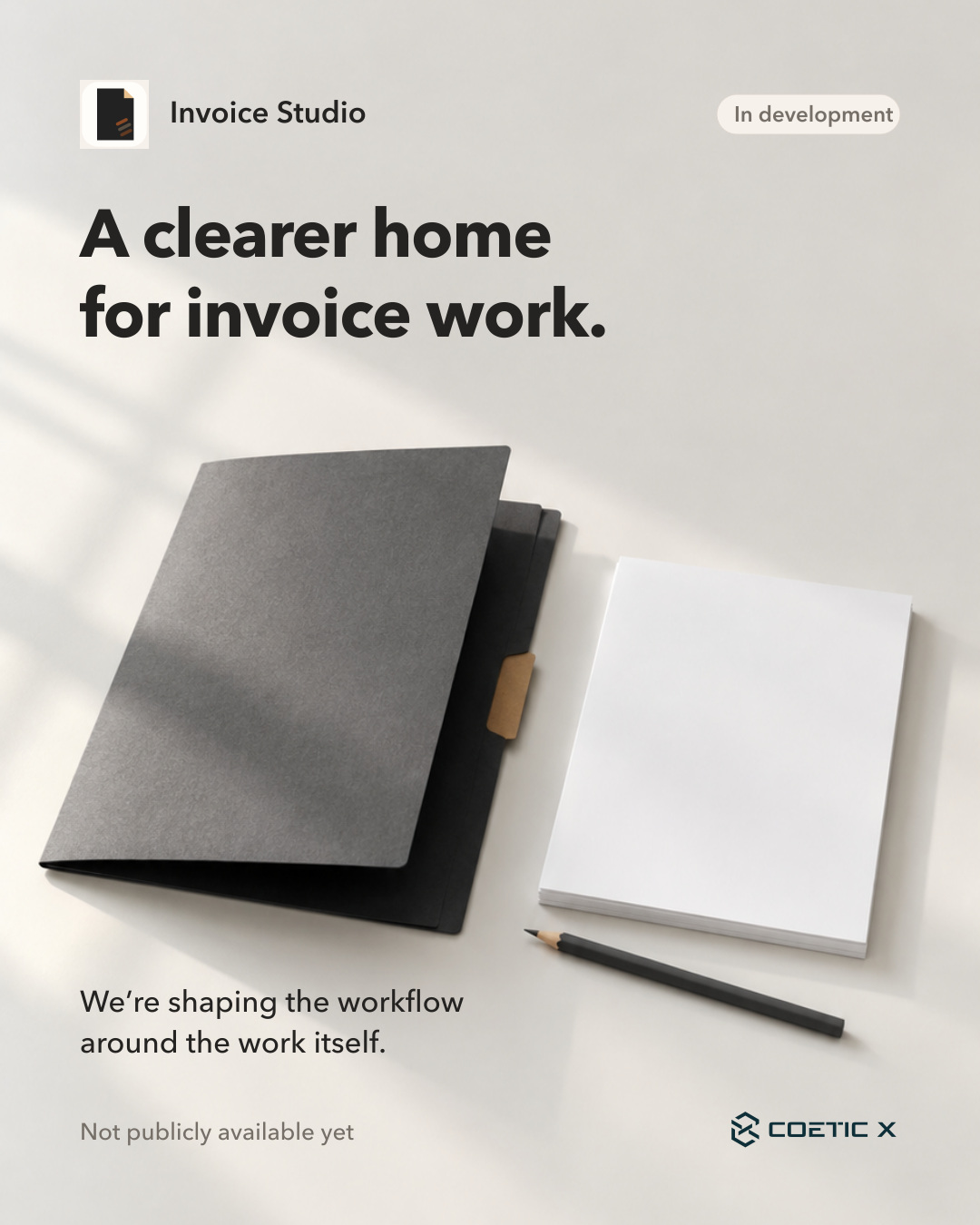 Invoice Studio development teaser with its corrected document icon, warm ivory desk, charcoal folder and blank paper. Text: A clearer home for invoice work. We’re shaping the workflow around the work itself. In development. Not publicly available yet. AI-generated illustrative photograph, no records or app UI.